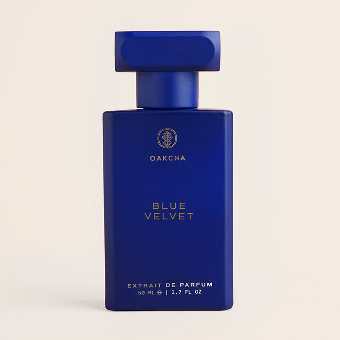 Front view of Blue Velvet 50ml bottle showcasing matte blue rectangular bottle with gold Oakcha logo on beige background