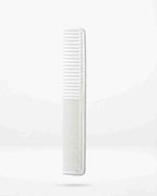White long hair comb with fine teeth, vertical close-up