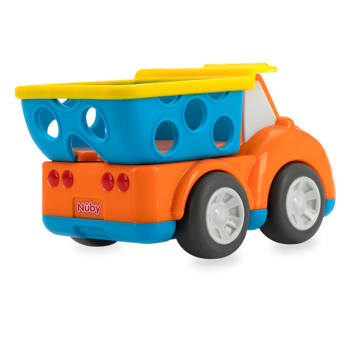 The Nuby Silly Shaker Rattle Toy - Construction Truck features an orange body, blue and yellow cargo bed with circular holes, and gray wheels, shown on a white background.