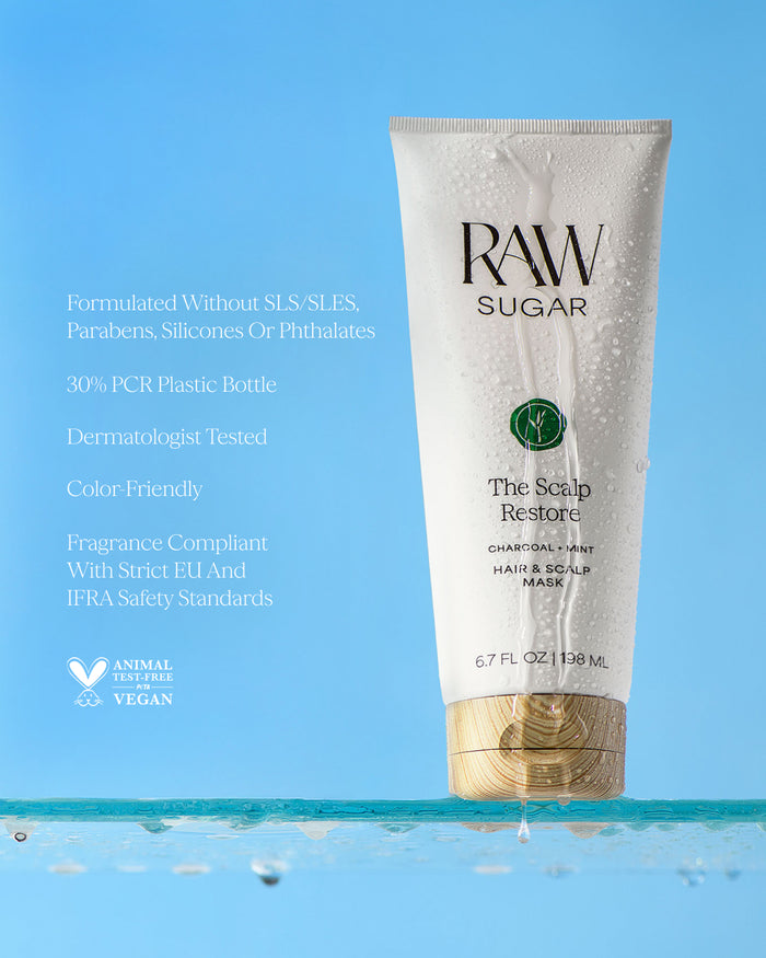 RAW Sugar hair and scalp mask tube on a blue background, designed to help purify scalp and hair with clean ingredients.