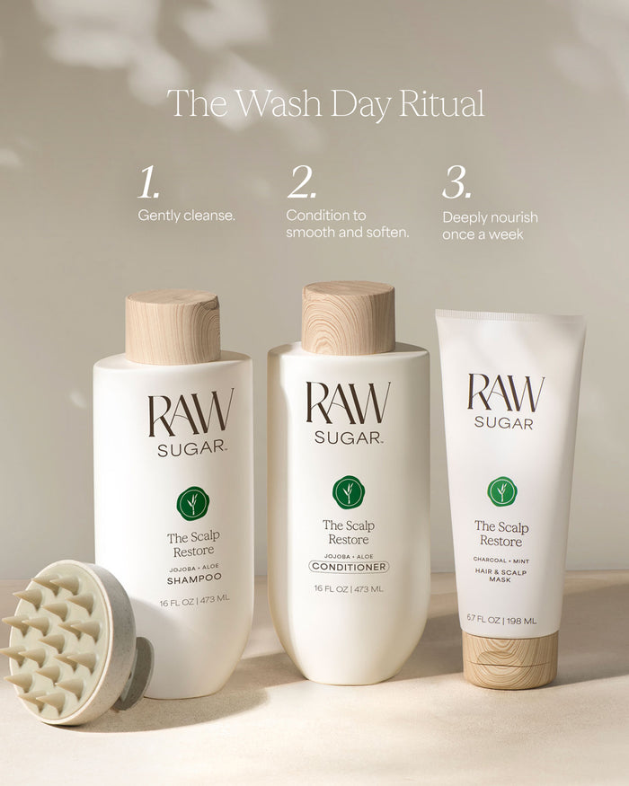 Three bottles of Raw Sugar hair care products on a neutral background with text 'The Wash Day Ritual'.